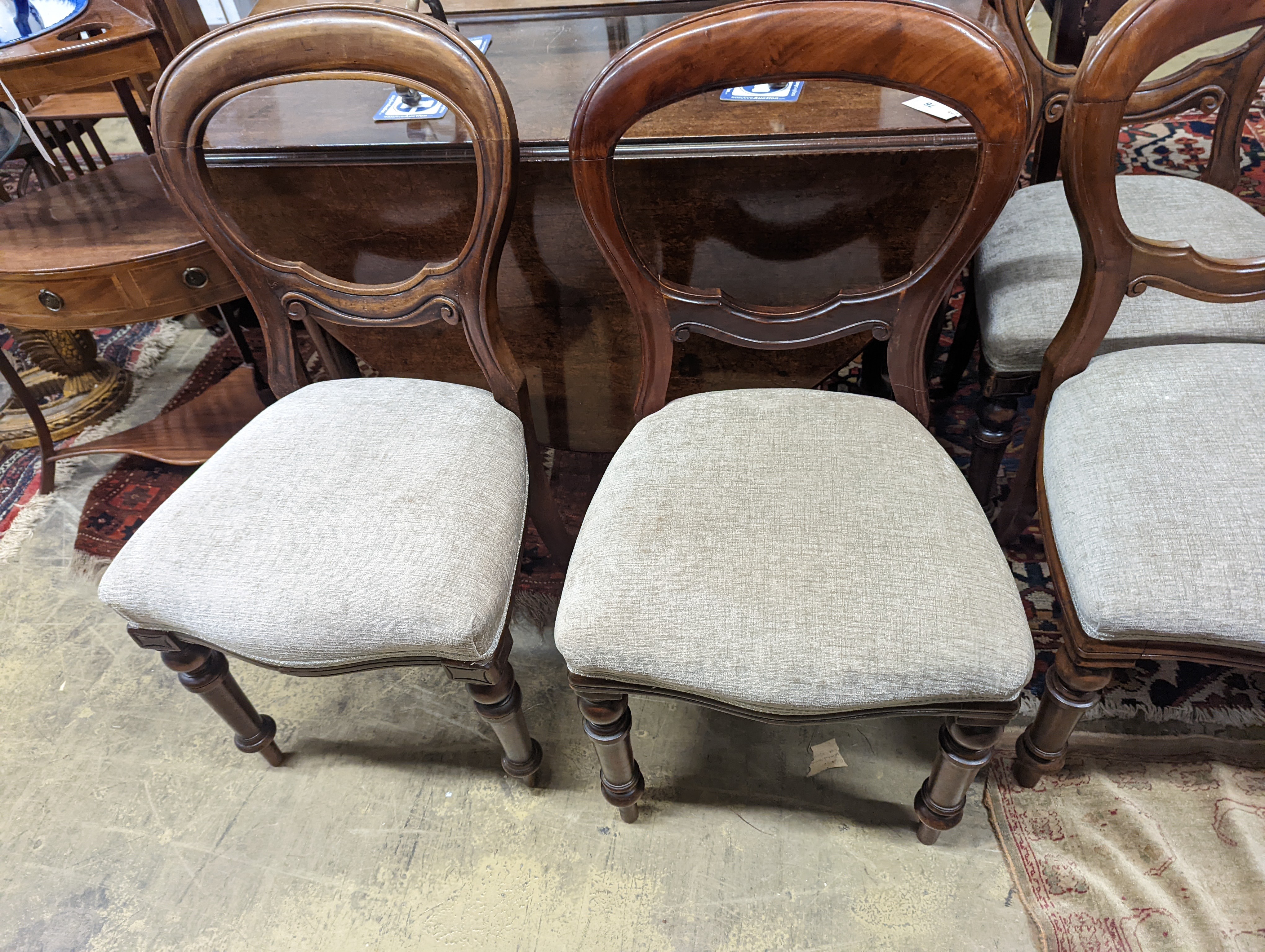 A set of six Victorian balloon back dining chairs